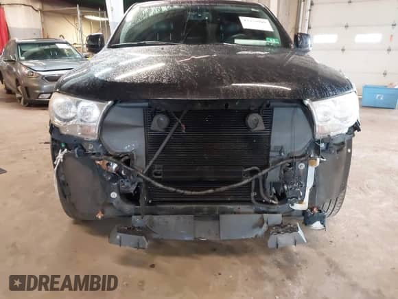 2013 Dodge Durango Crew with VIN 1C4RDJDG2DC670338, listed as a IAAI auction lot 42434949 with 176,202 mi miles and . Bid and sale history available at DreamBid. Image 6.