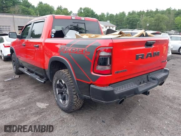 2022 Ram 1500 Rebel z VIN 1C6SRFLT1NN183823, wystawiony jako IAAI lot #42639735 z przebiegiem 36 048 mil mil oraz . Historia ofert i sprzedaży dostępna na DreamBid. Obrazek 3.