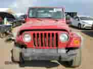 2003 Jeep Wrangler X z VIN 1J4FA39S33P308881, wystawiony jako Copart lot #69323655 z przebiegiem 264 257 mil mil oraz Szkoda całkowita • Salvage title. Historia ofert i sprzedaży dostępna na DreamBid. Obrazek 5.