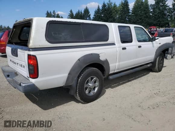 2003 Nissan Frontier XE with VIN 1N6ED29X13C419979, listed as a Copart auction lot 65806585 with 167,535 mi miles and Salvage title. Bid and sale history available at DreamBid. Image 3.