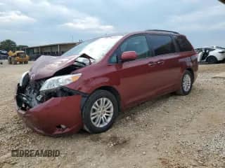 2011 Toyota Sienna XLE AAS with VIN 5TDYK3DC5BS050220, listed as a Copart auction lot 69008955 with 150,197 mi miles and Salvage title. Bid and sale history available at DreamBid. Image 1.