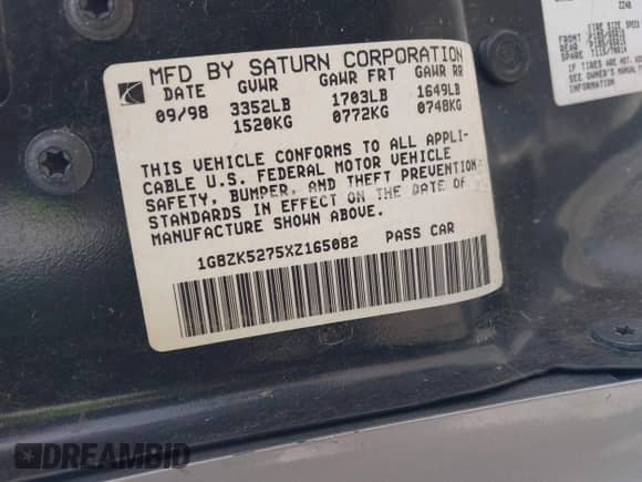 1999 Saturn SL z VIN 1G8ZK5275XZ165082, wystawiony jako IAAI lot #41939970 z przebiegiem 102 694 mil mil oraz . Historia ofert i sprzedaży dostępna na DreamBid. Obrazek 9.