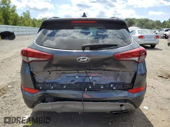 2018 Hyundai Tucson Limited with VIN KM8J3CA27JU677582, listed as a Copart auction lot 69106765 with 99,346 mi miles and Salvage title. Bid and sale history available at DreamBid. Image 6.