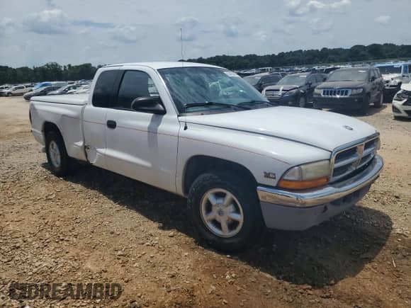 2000 Dodge Dakota с VIN 1B7GL22X1YS697058, выставлен на аукционе Copart как лот 63463645 с пробегом 246 206 миль миль и Списание • Salvage title. История ставок и продаж доступна на DreamBid. Изображение 4.