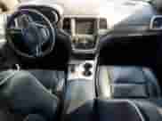 2015 Jeep Grand Cherokee Overland with VIN 1C4RJFCT1FC638648, listed as a Copart auction lot 61739035 with 110,519 mi miles and Salvage title. Bid and sale history available at DreamBid. Image 8.