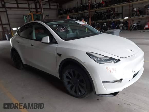2020 Tesla Model Y Long Range with VIN 5YJYGDEE1LF012853, listed as a IAAI auction lot 42289499 with 99,236 mi miles and . Bid and sale history available at DreamBid. Image 1.