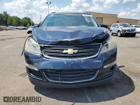 2016 Chevrolet Traverse LS z VIN 1GNKRFEDXGJ251150, wystawiony jako Copart lot #68369305 z przebiegiem Nie podano mil oraz Szkoda całkowita • Salvage title. Historia ofert i sprzedaży dostępna na DreamBid. Obrazek 5.