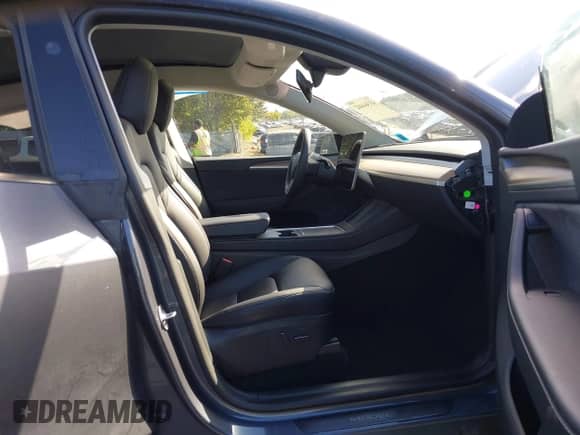 2023 Tesla Model Y Long Range with VIN 7SAYGDEE4PA192738, listed as a IAAI auction lot 43364402 with 14,872 mi miles and . Bid and sale history available at DreamBid. Image 5.