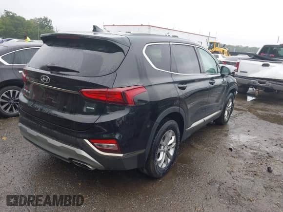 2019 Hyundai Santa Fe SEL with VIN 5NMS3CAD7KH131884, listed as a IAAI auction lot 43025635 with 70,150 mi miles and . Bid and sale history available at DreamBid. Image 4.