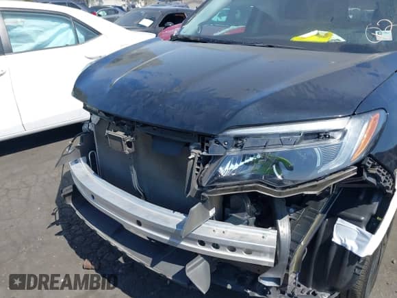 2022 Honda Pilot Special Edition with VIN 5FNYF5H24NB011709, listed as a IAAI auction lot 42604120 with 57,676 mi miles and . Bid and sale history available at DreamBid. Image 6.