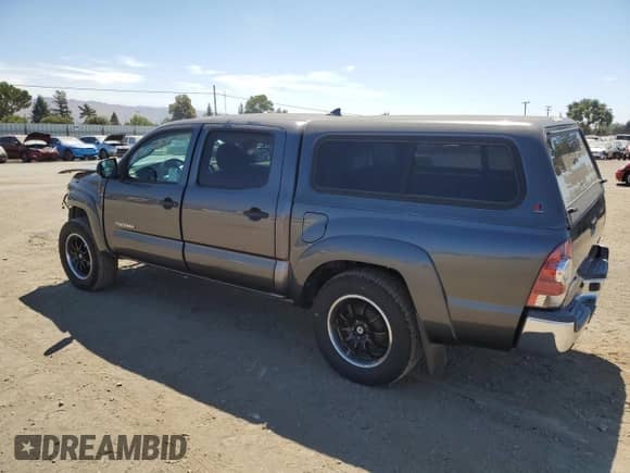 2015 Toyota Tacoma with VIN 5TFJX4CN8FX063880, listed as a Copart auction lot 68765415 with 115,810 mi miles and Salvage title. Bid and sale history available at DreamBid. Image 2.