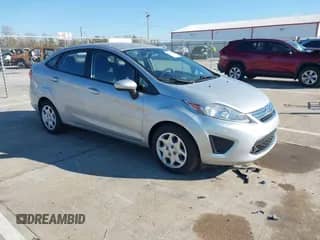 2012 Ford Fiesta SE z VIN 3FADP4BJ7CM207714, wystawiony jako IAAI lot #43542892 z przebiegiem 119 567 mil mil oraz . Historia ofert i sprzedaży dostępna na DreamBid. Obrazek 1.