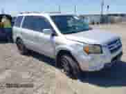 2006 Honda Pilot EX-L z VIN 2HKYF18606H511736, wystawiony jako IAAI lot #42731682 z przebiegiem 142 934 mil mil oraz . Historia ofert i sprzedaży dostępna na DreamBid. Obrazek 1.