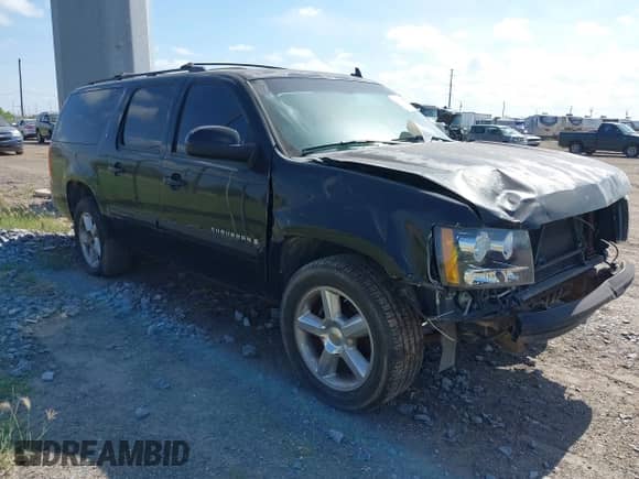 2007 Chevrolet Suburban LT z VIN 1GNFC16097J350432, wystawiony jako IAAI lot #42789067 z przebiegiem 316 142 mil mil oraz . Historia ofert i sprzedaży dostępna na DreamBid. Obrazek 1.
