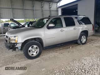 2009 Chevrolet Suburban 2LT with VIN 1GNFK26369R169036, listed as a Copart auction lot 83871775 with 253,894 mi miles and Salvage title. Bid and sale history available at DreamBid. Image 1.