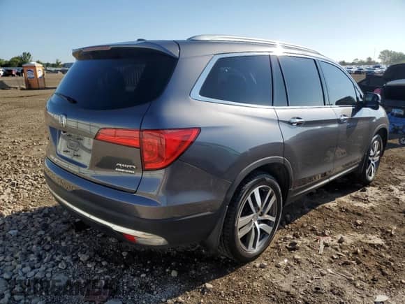 2017 Honda Pilot Touring with VIN 5FNYF6H97HB059373, listed as a Copart auction lot 71303275 with 114,263 mi miles and Salvage title. Bid and sale history available at DreamBid. Image 3.