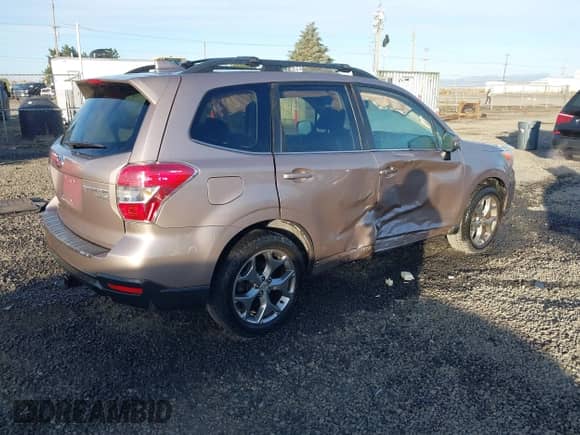 2016 Subaru Forester Touring with VIN JF2SJAXC9GH556784, listed as a IAAI auction lot 43378533 with 72,771 mi miles and . Bid and sale history available at DreamBid. Image 4.