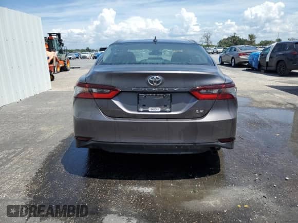 2023 Toyota Camry LE z VIN 4T1C11AK4PU103811, wystawiony jako Copart lot #70062385 z przebiegiem 46 128 mil mil oraz Czysty tytuł • Clean title. Historia ofert i sprzedaży dostępna na DreamBid. Obrazek 6.