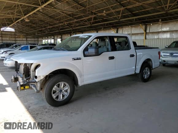 2020 Ford F-150 XL with VIN 1FTEW1C45LKD11814, listed as a Copart auction lot 69002595 with 106,500 mi miles and Salvage title. Bid and sale history available at DreamBid. Image 1.