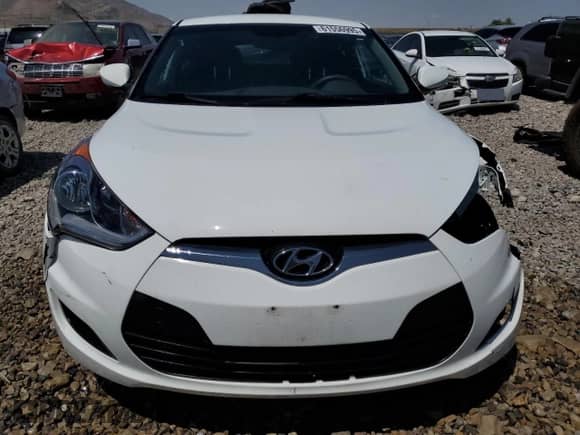 2016 Hyundai Veloster z VIN KMHTC6AD7GU287344, wystawiony jako Copart lot #61556995 z przebiegiem 92 715 mil mil oraz Szkoda całkowita • Salvage title. Historia ofert i sprzedaży dostępna na DreamBid. Obrazek 5.