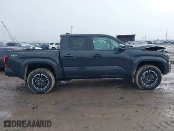 2024 Toyota Tacoma SR5 with VIN 3TMLB5JNXRM055645, listed as a IAAI auction lot 41208771 with 984 mi miles and . Bid and sale history available at DreamBid. Image 14.