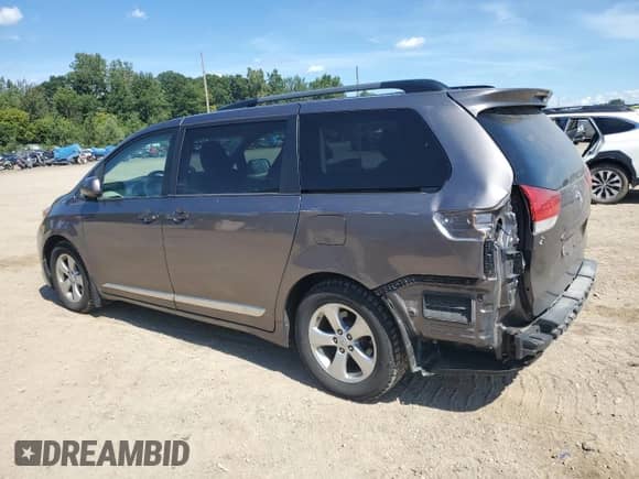 2014 Toyota Sienna LE AAS with VIN 5TDKK3DCXES518761, listed as a Copart auction lot 70665485 with 192,656 mi miles and Salvage title. Bid and sale history available at DreamBid. Image 2.