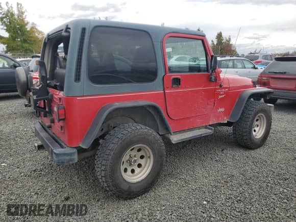 2001 Jeep Wrangler Sport with VIN 1J4FA49S11P339047, listed as a Copart auction lot 85923625 with 144,267 mi miles and Salvage title. Bid and sale history available at DreamBid. Image 3.