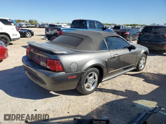 2004 Ford Mustang Deluxe с VIN 1FAFP44404F117628, выставлен на аукционе Copart как лот 81377524 с пробегом 39 697 миль миль и Списание • Salvage title. История ставок и продаж доступна на DreamBid. Изображение 3.
