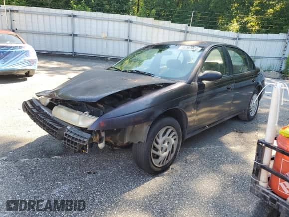 1999 Saturn SL z VIN 1G8ZK5276XZ314325, wystawiony jako Copart lot #66461025 z przebiegiem 227 494 mil mil oraz Szkoda całkowita • Salvage title. Historia ofert i sprzedaży dostępna na DreamBid. Obrazek 1.
