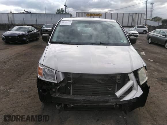 2010 Dodge Grand Caravan SE with VIN 2D4RN4DE1AR403162, listed as a IAAI auction lot 40386723 with 82,290 mi miles and . Bid and sale history available at DreamBid. Image 12.