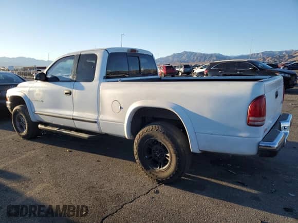 1998 Dodge Dakota SLT z VIN 1B7GG22Y1WS544271, wystawiony jako Copart lot #88781885 z przebiegiem 149 417 mil mil oraz Szkoda całkowita • Salvage title. Historia ofert i sprzedaży dostępna na DreamBid. Obrazek 2.