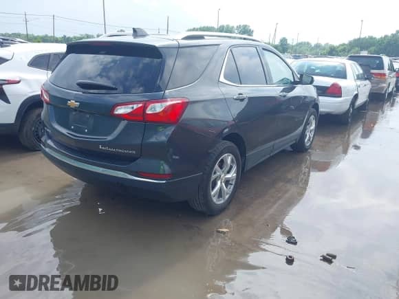 2021 Chevrolet Equinox Premier with VIN 2GNAXNEVXM6140093, listed as a IAAI auction lot 42627819 with 36,271 mi miles and . Bid and sale history available at DreamBid. Image 4.