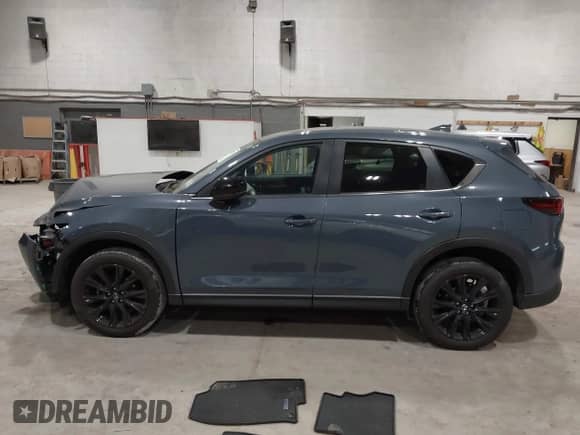 2022 Mazda CX-5 S Preferred z VIN JM3KFBCM1N0551165, wystawiony jako IAAI lot #42277023 z przebiegiem 34 115 mil mil oraz . Historia ofert i sprzedaży dostępna na DreamBid. Obrazek 13.
