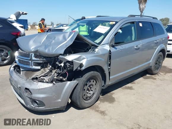 2019 Dodge Journey SE with VIN 3C4PDCBG0KT798004, listed as a IAAI auction lot 43012657 with 74,633 mi miles and . Bid and sale history available at DreamBid. Image 2.