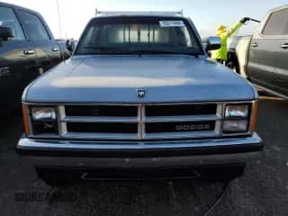 1989 Dodge Dakota z VIN 1B7GG26X9KS021432, wystawiony jako Copart lot #78311494 z przebiegiem 106 224 mil mil oraz Nie do naprawy • Non repairable. Historia ofert i sprzedaży dostępna na DreamBid. Obrazek 5.