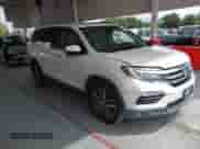 2017 Honda Pilot Touring with VIN 5FNYF5H91HB015492, listed as a IAAI auction lot 43251136 with 131,082 mi miles and . Bid and sale history available at DreamBid. Image 1.