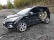 2017 Ford Escape Titanium with VIN 1FMCU0J90HUB64587, listed as a Copart auction lot 86682055 with 64,514 mi miles and Salvage title. Bid and sale history available at DreamBid. Image 1.