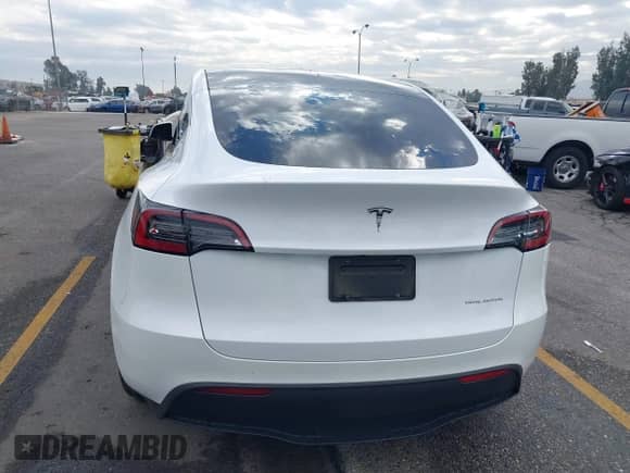 2023 Tesla Model Y Long Range with VIN 7SAYGAEE2PF763662, listed as a IAAI auction lot 43412618 with 43,857 mi miles and . Bid and sale history available at DreamBid. Image 16.