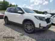 2023 Honda Passport EX-L with VIN 5FNYF8H5XPB018355, listed as a Copart auction lot 66667405 with 26,126 mi miles and Salvage title. Bid and sale history available at DreamBid. Image 4.