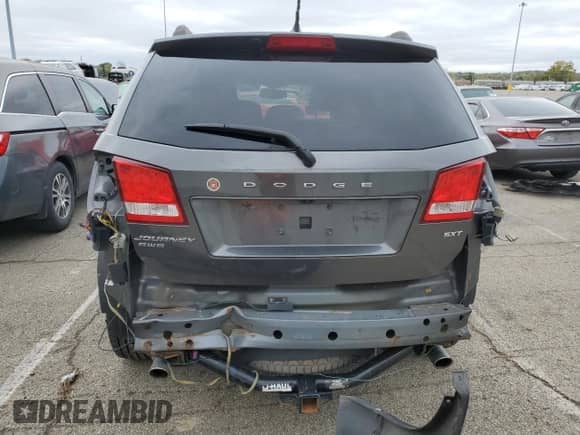 2014 Dodge Journey SXT with VIN 3C4PDDBG2ET152098, listed as a Copart auction lot 87373335 with 130,064 mi miles and Salvage title. Bid and sale history available at DreamBid. Image 6.