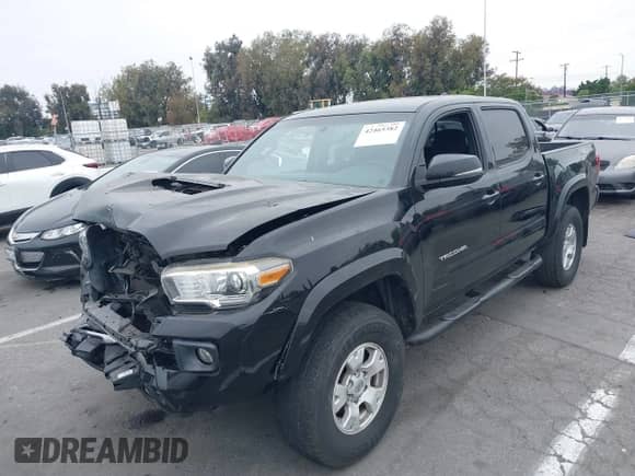 2017 Toyota Tacoma SR5 with VIN 3TMAZ5CN4HM047698, listed as a IAAI auction lot 42465382 with 132,297 mi miles and . Bid and sale history available at DreamBid. Image 2.