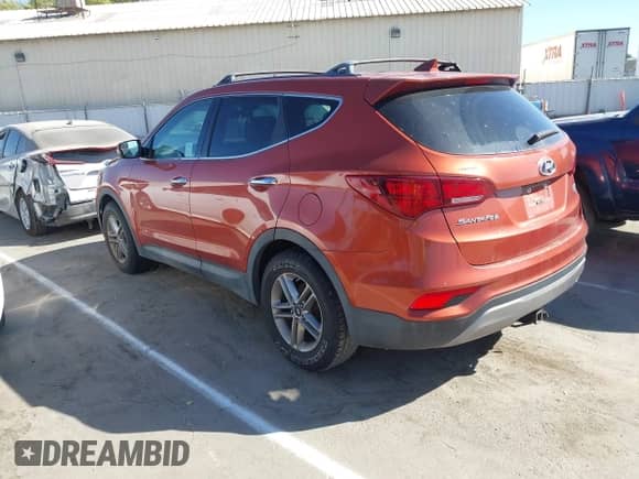 2017 Hyundai Santa Fe 2.4L z VIN 5XYZTDLB1HG443833, wystawiony jako IAAI lot #42908168 z przebiegiem 137 312 mil mil oraz . Historia ofert i sprzedaży dostępna na DreamBid. Obrazek 3.