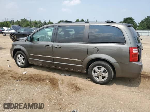 2010 Dodge Grand Caravan SXT с VIN 2D4RN5D11AR269031, выставлен на аукционе Copart как лот 67026245 с пробегом 142 710 миль миль и Списание • Salvage title. История ставок и продаж доступна на DreamBid. Изображение 2.
