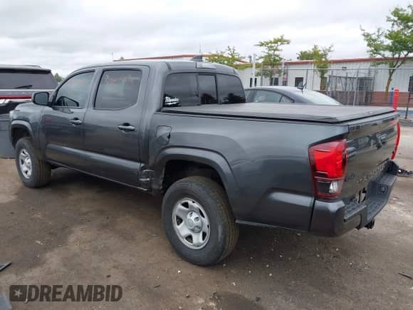 2023 Toyota Tacoma SR with VIN 3TMCZ5ANXPM538495, listed as a IAAI auction lot 42993850 with 41,728 mi miles and . Bid and sale history available at DreamBid. Image 3.