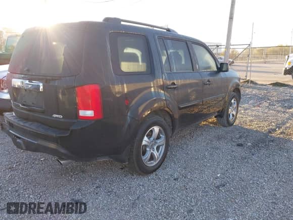 2015 Honda Pilot EX-L with VIN 5FNYF4H56FB052123, listed as a IAAI auction lot 43427901 with 197,741 mi miles and . Bid and sale history available at DreamBid. Image 4.