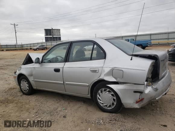 2003 Hyundai Accent GL z VIN KMHCG45C03U486899, wystawiony jako Copart lot #49313845 z przebiegiem 50 641 mil mil oraz Szkoda całkowita • Salvage title. Historia ofert i sprzedaży dostępna na DreamBid. Obrazek 2.