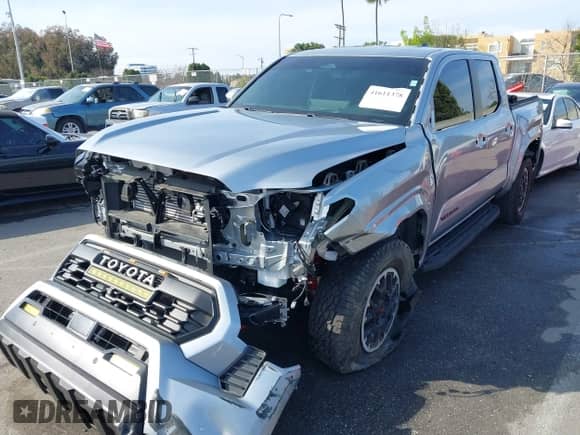 2024 Toyota Tacoma SR5 with VIN 3TMLB5JN6RM022612, listed as a IAAI auction lot 41611378 with 7,275 mi miles and . Bid and sale history available at DreamBid. Image 2.