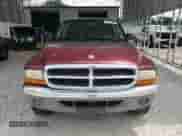 2001 Dodge Dakota Sport z VIN 1B7GG2AN21S104169, wystawiony jako Copart lot #67199295 z przebiegiem 233 541 mil mil oraz Szkoda całkowita • Salvage title. Historia ofert i sprzedaży dostępna na DreamBid. Obrazek 5.