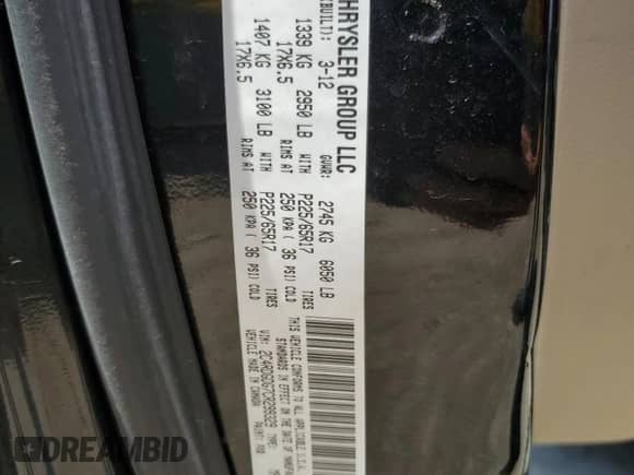 2012 Dodge Grand Caravan Crew with VIN 2C4RDGDG7CR299329, listed as a Copart auction lot 68716235 with 168,908 mi miles and Salvage title. Bid and sale history available at DreamBid. Image 13.