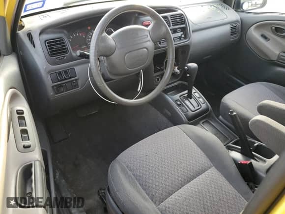 2003 Chevrolet Tracker with VIN 2CNBE18C136928311, listed as a Copart auction lot 84463154 with 118,195 mi miles and Salvage title. Bid and sale history available at DreamBid. Image 8.